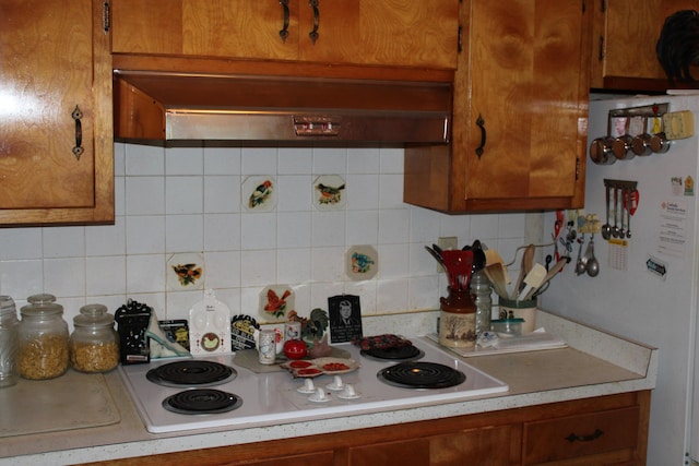 6 Woodside Dr, Arcanum, OH 45304 - kitchen featuring white appliances, brown cabinetry, and light countertops