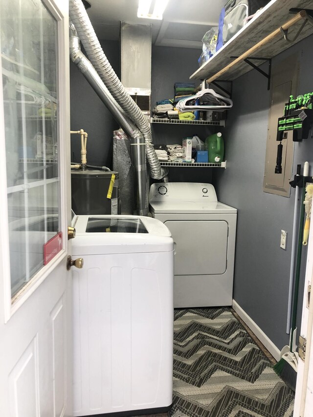 washroom featuring laundry area, independent washer and dryer, and baseboards