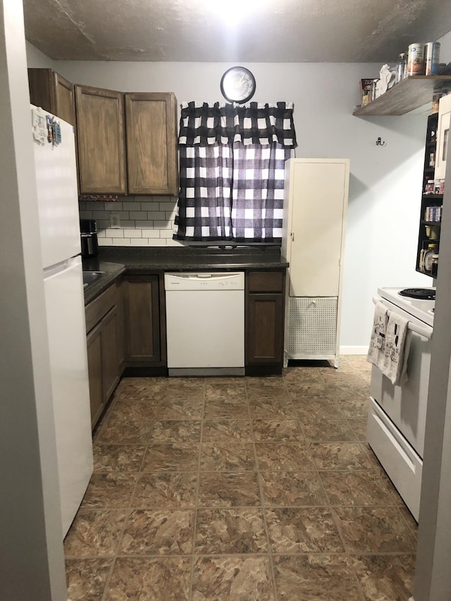 kitchen featuring tasteful backsplash, dark countertops, white appliances, and open shelves