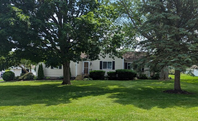 3727 Groves Rd, Lima, OH 45805 - obstructed view of property featuring a front yard