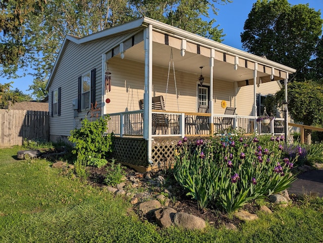 3727 Groves Rd, Lima, OH 45805 - rear view of house with covered porch and an attached carport