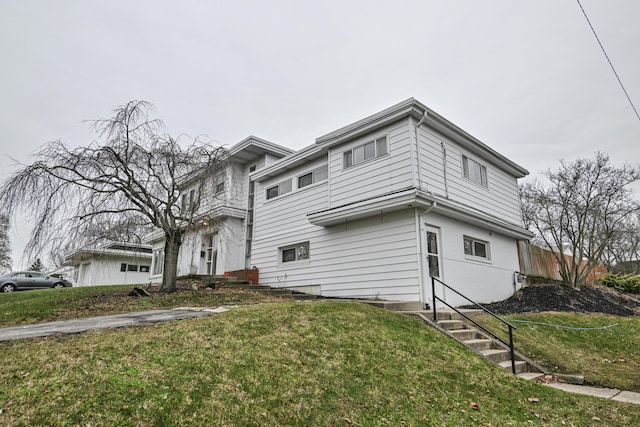 view of side of property featuring a yard