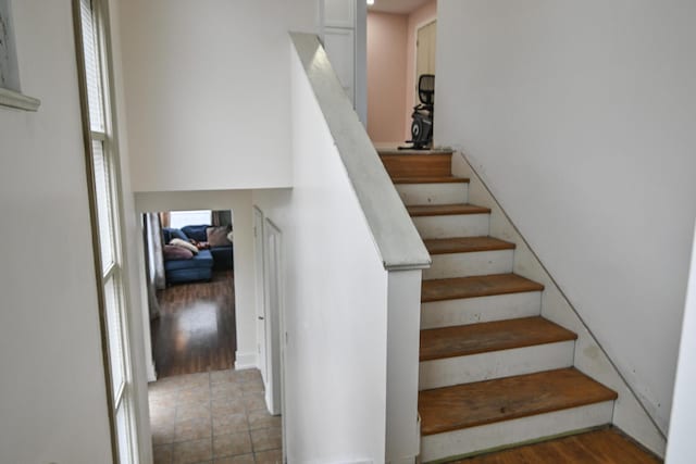 staircase with a wealth of natural light