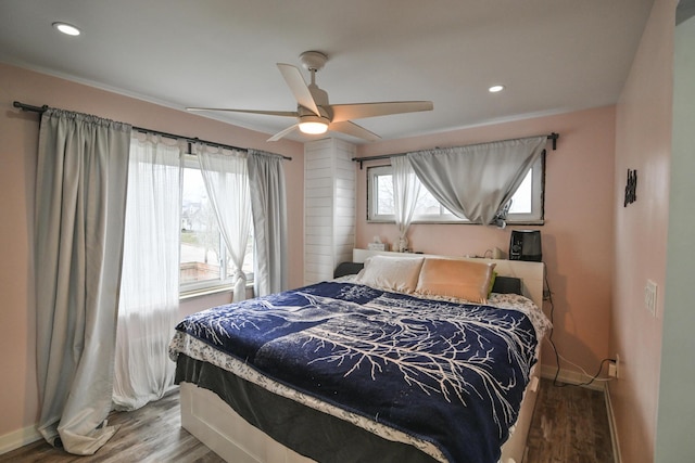 bedroom featuring wood-type flooring and ceiling fan