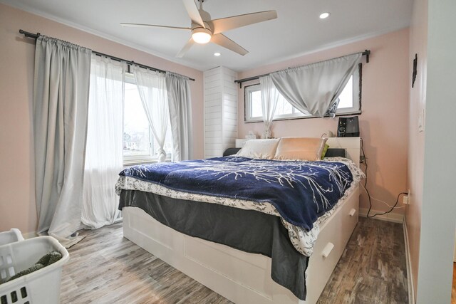 bedroom featuring wood-type flooring and ceiling fan