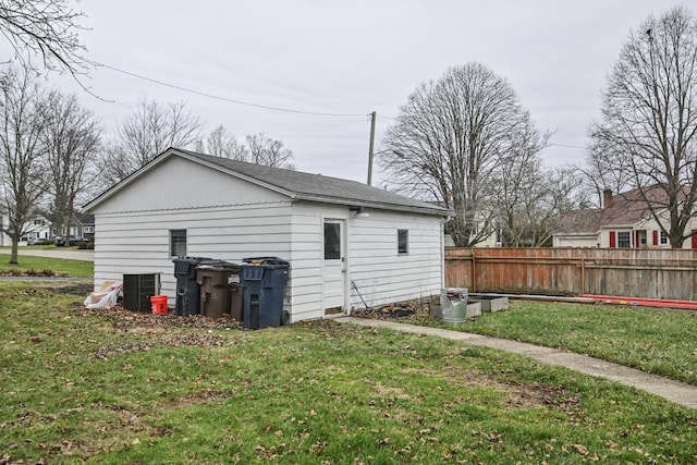 back of property featuring a yard