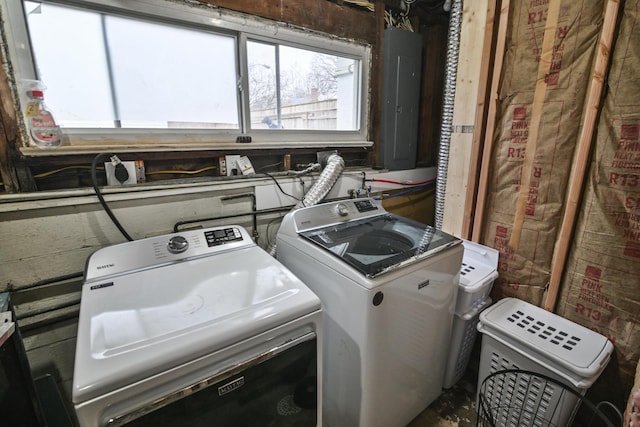 washroom featuring electric panel and separate washer and dryer