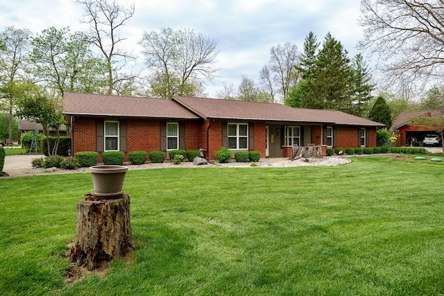 ranch-style house with brick siding, a front lawn, and a porch