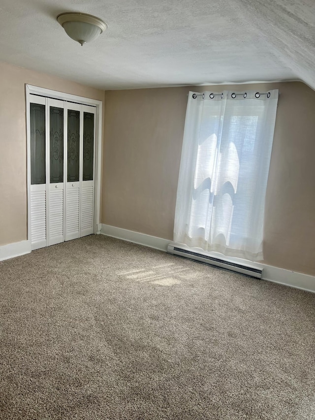 9969 State Route 49, Rockford, OH 45882 - carpeted spare room featuring a baseboard radiator and a textured ceiling