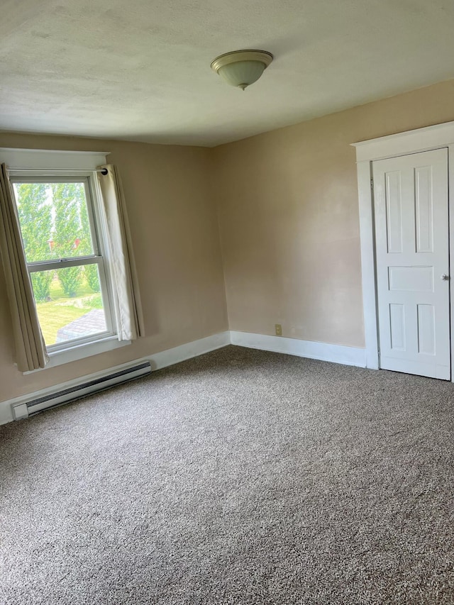 9969 State Route 49, Rockford, OH 45882 - empty room with a baseboard radiator and carpet flooring