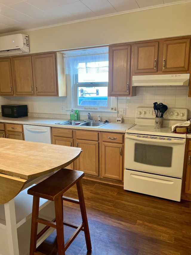 9969 State Route 49, Rockford, OH 45882 - kitchen with white appliances, a wall mounted AC, under cabinet range hood, decorative backsplash, and ornamental molding