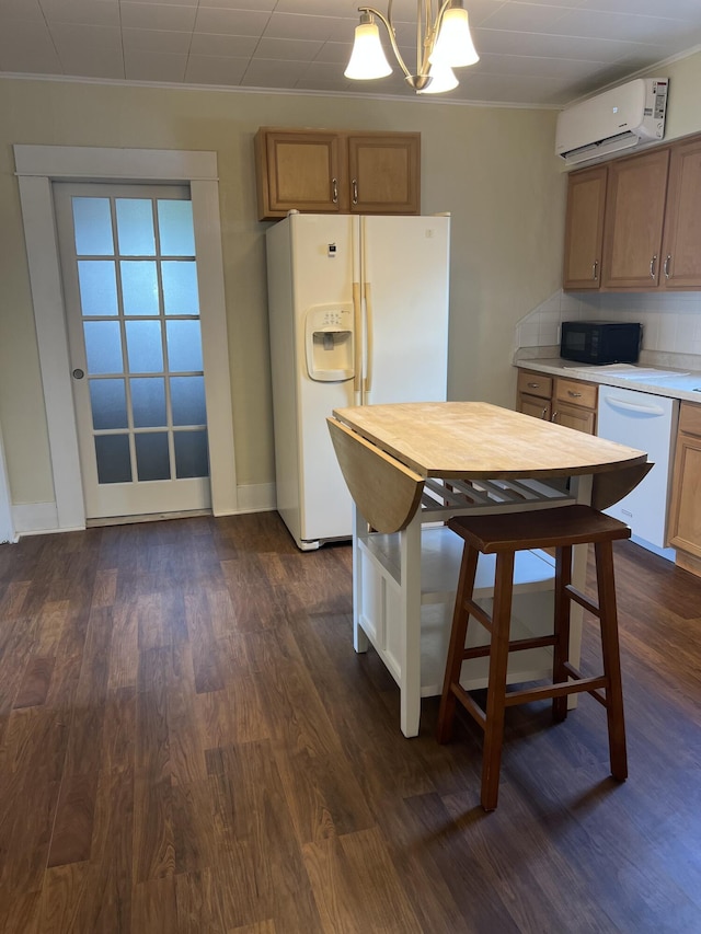 9969 State Route 49, Rockford, OH 45882 - kitchen with white appliances, a wall mounted air conditioner, a chandelier, ornamental molding, and dark wood-type flooring