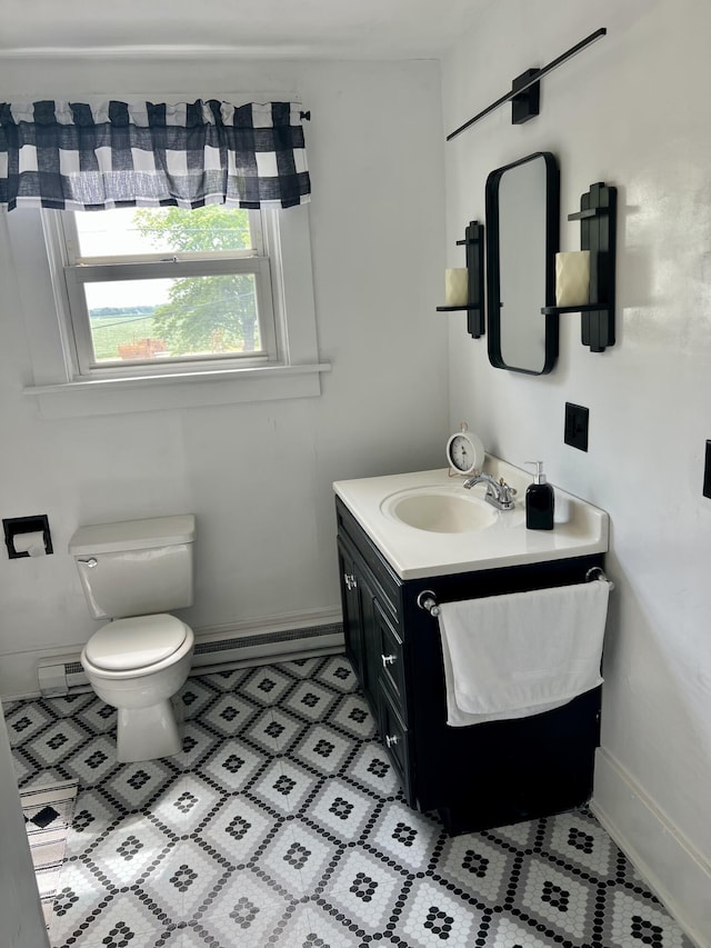 9969 State Route 49, Rockford, OH 45882 - bathroom with a baseboard heating unit, vanity, tile patterned floors, and baseboard heating