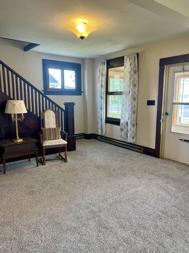 9969 State Route 49, Rockford, OH 45882 - sitting room with a baseboard radiator, stairway, and carpet floors