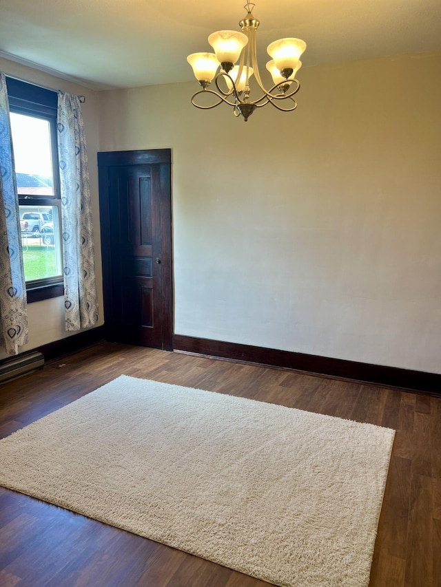 9969 State Route 49, Rockford, OH 45882 - spare room with a chandelier and wood finished floors