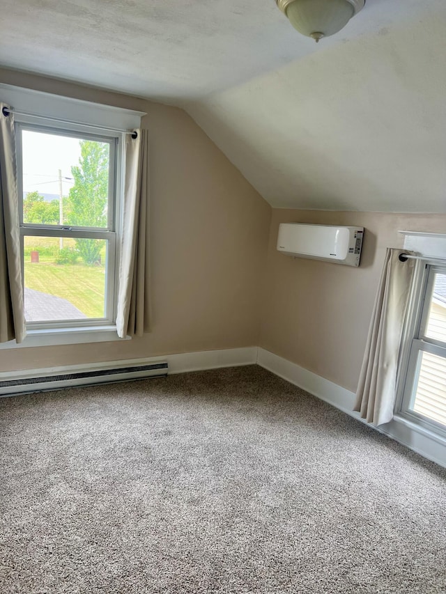 9969 State Route 49, Rockford, OH 45882 - additional living space with a wall unit AC, a baseboard heating unit, vaulted ceiling, and carpet