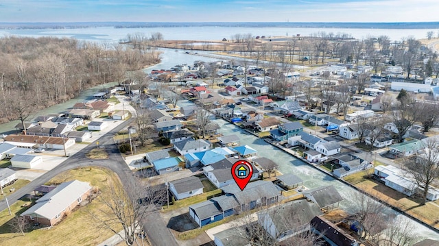 bird's eye view featuring a water view and a residential view