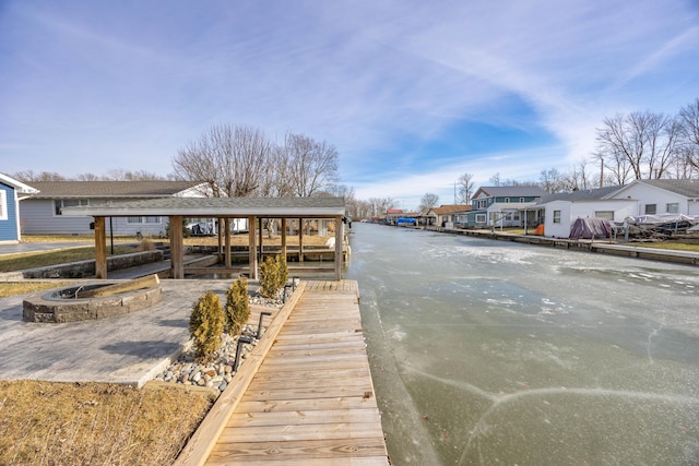 dock area featuring a residential view and a fire pit