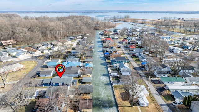 bird's eye view with a residential view and a water view