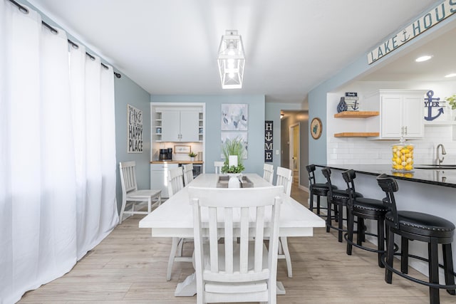 dining room with light wood-type flooring