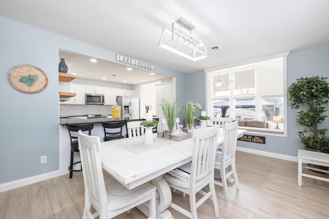 dining area featuring a ceiling fan, recessed lighting, light wood-style floors, and baseboards