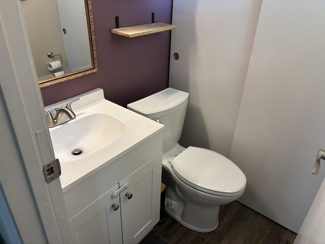 1353 Lee Rd, Troy, OH 45373 - half bathroom with wood finished floors, vanity, and toilet