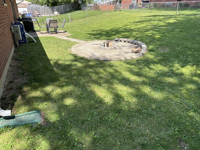 1353 Lee Rd, Troy, OH 45373 - view of yard with an outdoor fire pit and a patio area