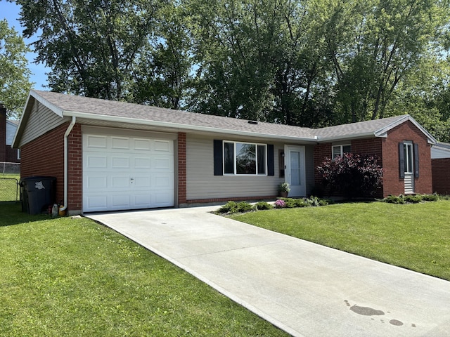 1353 Lee Rd, Troy, OH 45373 - ranch-style house featuring a garage, driveway, and brick siding