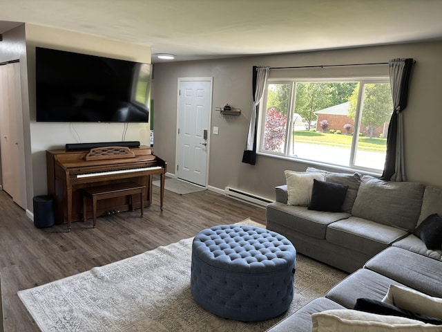 1353 Lee Rd, Troy, OH 45373 - living room with baseboard heating, wood finished floors, and baseboards