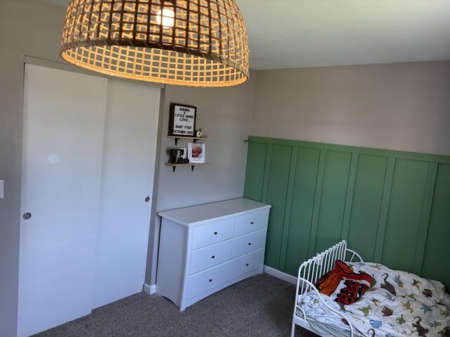 1353 Lee Rd, Troy, OH 45373 - bedroom with carpet flooring, a decorative wall, and a wainscoted wall