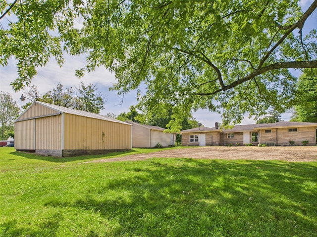 1430 E Union City Pike E, Union City Pike, Winchester, IN 47394 - view of grassy yard featuring a pole building and an outdoor structure