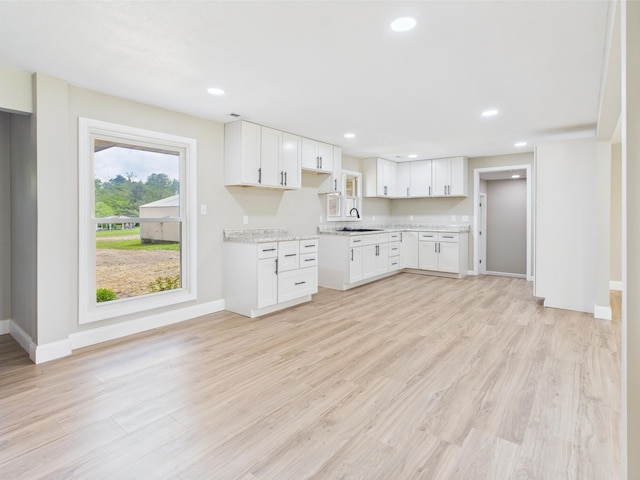 1430 E Union City Pike E, Union City Pike, Winchester, IN 47394 - kitchen with light wood-type flooring, white cabinets, and recessed lighting