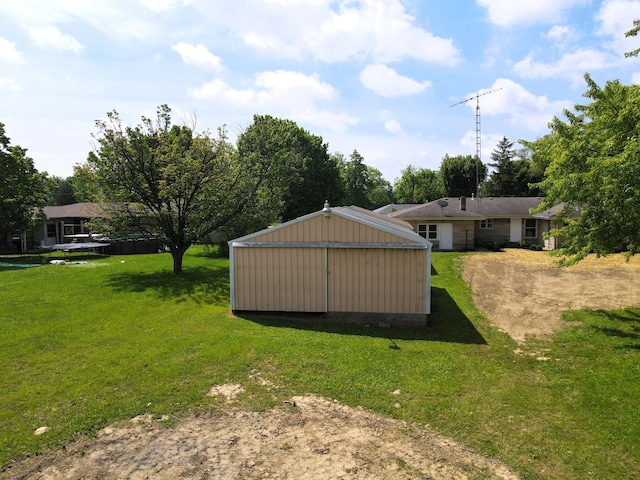 1430 E Union City Pike E, Union City Pike, Winchester, IN 47394 - view of grassy yard with driveway, an outbuilding, and a garage