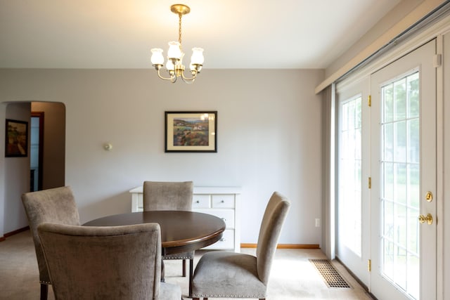 1706 N Fountain Blvd, Springfield, OH 45504 - dining space with a chandelier and light colored carpet