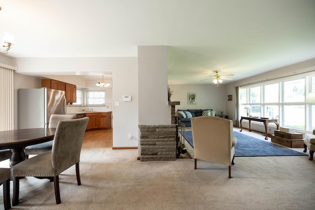 1706 N Fountain Blvd, Springfield, OH 45504 - dining area featuring a chandelier, light colored carpet, and ceiling fan