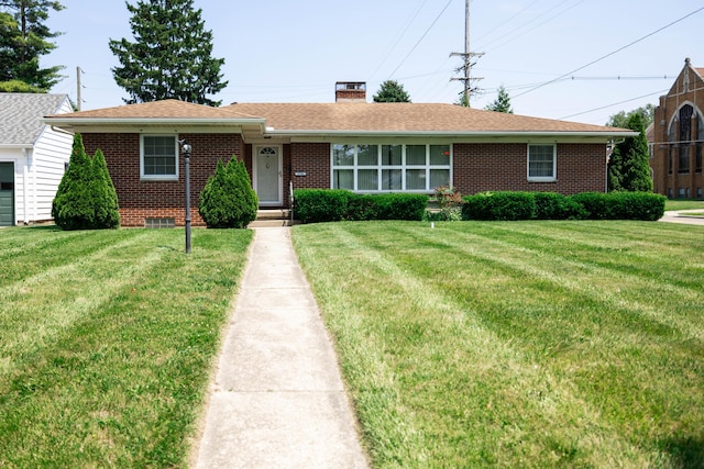 1706 N Fountain Blvd, Springfield, OH 45504 - ranch-style home featuring brick siding, a chimney, and a front yard
