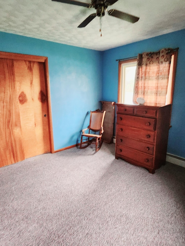 bedroom featuring carpet flooring, a ceiling fan, and baseboards