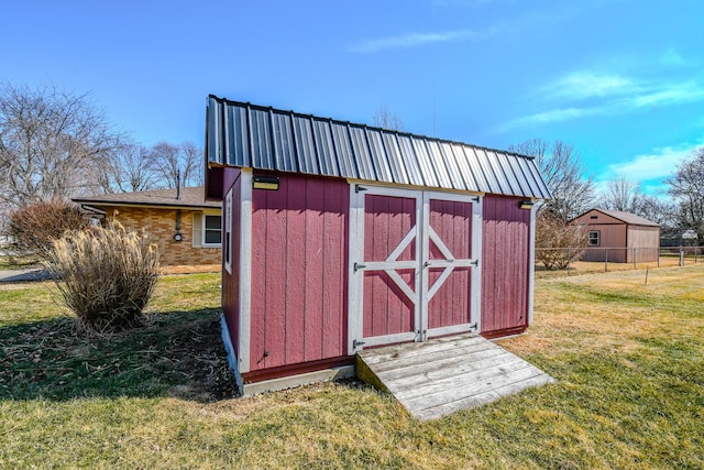 view of shed with fence