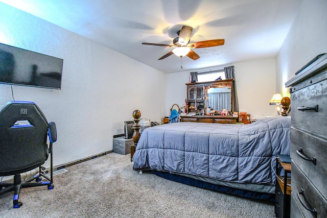 bedroom featuring a ceiling fan, carpet, and baseboards