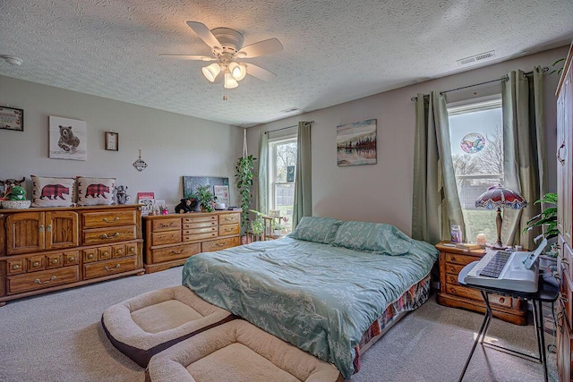 1313 Arrowhead, Piqua, OH 45356 - carpeted bedroom with a textured ceiling and ceiling fan