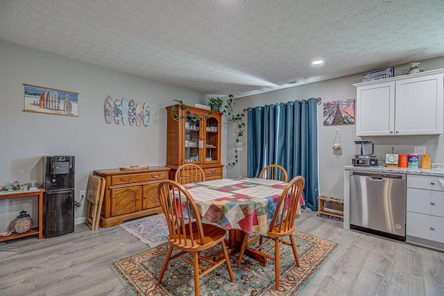 1313 Arrowhead, Piqua, OH 45356 - dining area featuring light wood-style floors, a textured ceiling, and recessed lighting