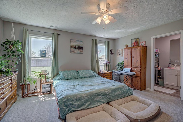 1313 Arrowhead, Piqua, OH 45356 - bedroom featuring light colored carpet, a textured ceiling, and ceiling fan