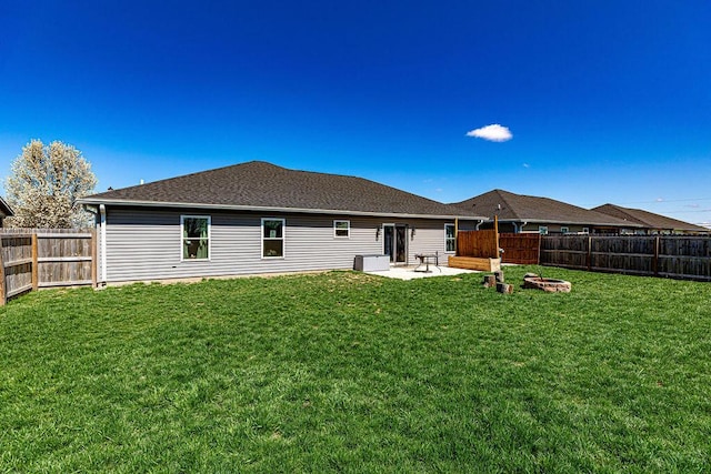 1313 Arrowhead, Piqua, OH 45356 - back of house featuring a fenced backyard, a patio, and roof with shingles