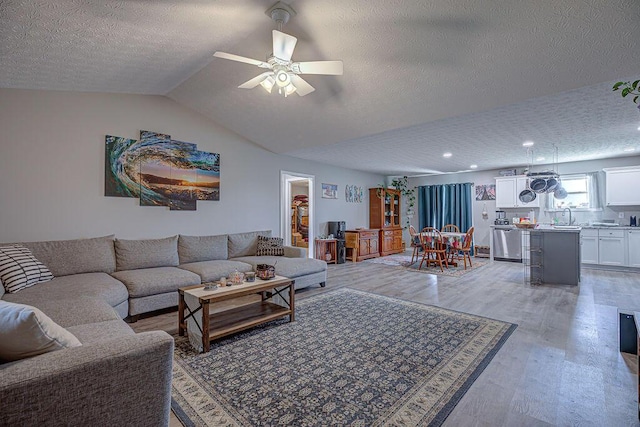 1313 Arrowhead, Piqua, OH 45356 - living area featuring a textured ceiling, light wood-style flooring, ceiling fan, lofted ceiling, and recessed lighting