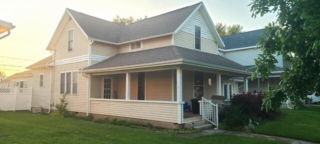 611 N Sugar St, Celina, OH 45822 - view of front of home with covered porch, a front lawn, and crawl space