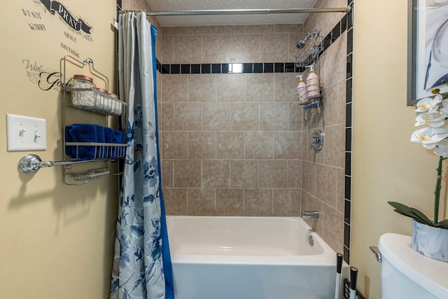 full bathroom featuring shower / tub combo and toilet