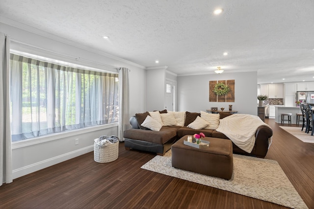 1814 Kingsbury Dr, Saint Marys, OH 45885 - living room featuring a textured ceiling, plenty of natural light, recessed lighting, crown molding, and dark wood-style floors