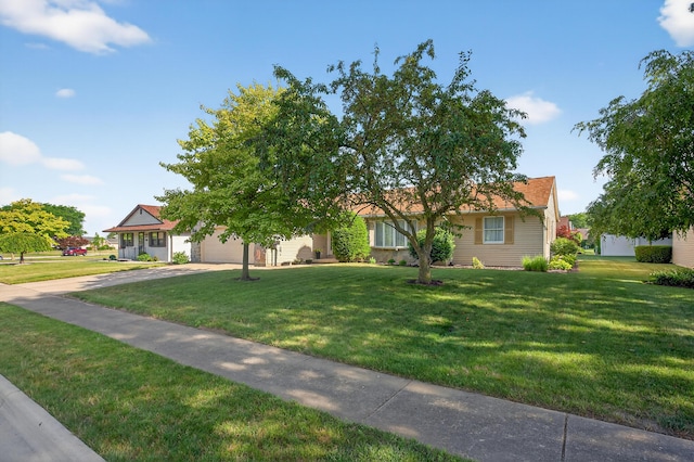 1814 Kingsbury Dr, Saint Marys, OH 45885 - view of front of home with concrete driveway, a front lawn, and a garage