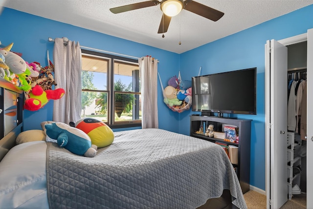 1814 Kingsbury Dr, Saint Marys, OH 45885 - carpeted bedroom with a ceiling fan and a textured ceiling