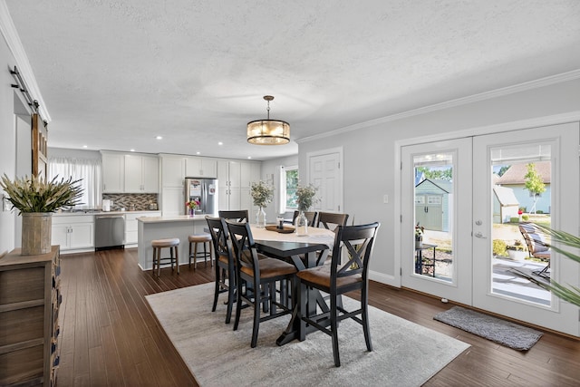 1814 Kingsbury Dr, Saint Marys, OH 45885 - dining area with a textured ceiling, dark wood-style floors, crown molding, a barn door, and recessed lighting